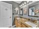 Bathroom features a double vanity with granite countertop, mirrors, and a door to the toilet at 604 Young Forest Dr, Wake Forest, NC 27587