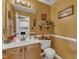Bathroom featuring a vanity, toilet, mirror, neutral paint, and decorative accents at 604 Young Forest Dr, Wake Forest, NC 27587