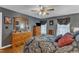 Bedroom features wooden dressers, natural light, hardwood floors, and calming paint at 604 Young Forest Dr, Wake Forest, NC 27587