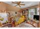 Bedroom with wooden bed frame, vintage decorations, natural light, and wooden floors at 604 Young Forest Dr, Wake Forest, NC 27587
