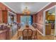 This formal dining room boasts a large table, and elegant lighting at 604 Young Forest Dr, Wake Forest, NC 27587