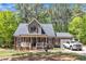 Charming two-story home with a welcoming front porch and well-maintained landscaping at 604 Young Forest Dr, Wake Forest, NC 27587