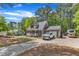 Property with a long driveway, ample parking, and a well-kept exterior in a wooded setting at 604 Young Forest Dr, Wake Forest, NC 27587