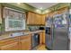 Efficient kitchen design with stainless steel appliances and wooden cabinetry at 604 Young Forest Dr, Wake Forest, NC 27587