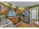 Functional kitchen featuring stainless steel appliances, light wood cabinets and ample counter space at 604 Young Forest Dr, Wake Forest, NC 27587