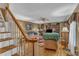 Inviting living room features hardwood floors, a cozy sofa, and a built-in entertainment center at 604 Young Forest Dr, Wake Forest, NC 27587