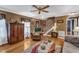 Warm, inviting living room features hardwood floors and plenty of seating and storage at 604 Young Forest Dr, Wake Forest, NC 27587