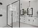 Bright bathroom features dual sinks, sleek fixtures, and a glass shower at 6406 Tanner Oak Ln, Raleigh, NC 27613