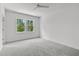 Spacious bedroom features plush carpeting and sun-filled windows at 6406 Tanner Oak Ln, Raleigh, NC 27613