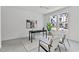 Well-lit office space with desk, chairs, and windows that let in natural light at 6406 Tanner Oak Ln, Raleigh, NC 27613