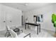 Bright home office featuring a desk with décor, chairs and art at 6406 Tanner Oak Ln, Raleigh, NC 27613
