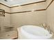 A luxurious soaking tub is featured in a large bathroom with walk-in shower at 673 Brookview Dr, Chapel Hill, NC 27514