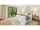 Inviting bedroom with sliding glass doors leading to a private balcony and natural light at 673 Brookview Dr, Chapel Hill, NC 27514