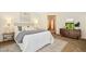 Comfortable bedroom with natural light, neutral tones, and a peaceful view at 673 Brookview Dr, Chapel Hill, NC 27514