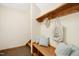 Entryway features a wood bench with storage, pillows, shelving, hooks and steps to another level at 673 Brookview Dr, Chapel Hill, NC 27514