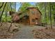 Cozy two-story home with a quaint white front door and a wooden deck at 673 Brookview Dr, Chapel Hill, NC 27514