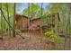 Two-story home featuring an expansive backyard and multiple balconies at 673 Brookview Dr, Chapel Hill, NC 27514