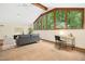 Open living room featuring large windows with natural light and a cozy workspace at 673 Brookview Dr, Chapel Hill, NC 27514