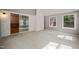 Spacious bedroom with gray walls, plush carpet, and sliding glass doors, creating a tranquil and inviting atmosphere at 6804 Justice Dr, Raleigh, NC 27615