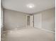 Neutral bedroom with carpeted floors, closet with louvered doors and an open doorway to another room at 6804 Justice Dr, Raleigh, NC 27615