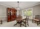 Formal dining room featuring an elegant china cabinet and classic chandelier at 6804 Justice Dr, Raleigh, NC 27615