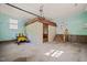 Spacious garage interior with ample storage space and stairs leading to the outside at 6804 Justice Dr, Raleigh, NC 27615