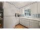 Clean kitchen with classic white appliances and bright natural light at 6804 Justice Dr, Raleigh, NC 27615