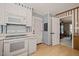 Efficient kitchen featuring white appliances and ample counter space at 6804 Justice Dr, Raleigh, NC 27615