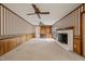 Comfortable living room with a charming brick fireplace and built-in shelving at 6804 Justice Dr, Raleigh, NC 27615