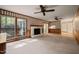 Bright living room with large windows and a brick fireplace at 6804 Justice Dr, Raleigh, NC 27615