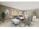 Comfortable living room featuring neutral decor, large windows, stylish furniture, and a welcoming atmosphere at 6804 Justice Dr, Raleigh, NC 27615