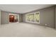 Spacious living room with large windows offering plenty of natural light at 6804 Justice Dr, Raleigh, NC 27615