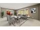 Bright living room featuring large windows, neutral tones, stylish furniture, and an elegant dining area at 6804 Justice Dr, Raleigh, NC 27615