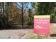 Neighborhood East Fork Mine Creek Trail sign, surrounded by a lush greenway at 6804 Justice Dr, Raleigh, NC 27615