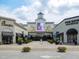 View of a vibrant shopping center featuring various restaurants and a prominent movie theater at 6804 Justice Dr, Raleigh, NC 27615
