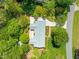 Aerial view of the property showcasing the home's roof, driveway, and surrounding trees at 7 Dubarry Ct, Durham, NC 27705
