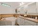 Beautiful bathroom featuring double vanity, granite countertops and a tub for relaxation at 7 Dubarry Ct, Durham, NC 27705