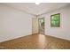Bright bedroom with vintage flooring, a large window, and neutral wall color at 7 Dubarry Ct, Durham, NC 27705