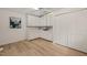 Versatile bonus room with vaulted ceiling, fan, closet, and built-in cabinetry at 7 Dubarry Ct, Durham, NC 27705