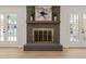 Attractive brick fireplace with hearth, mantle, and charming decor in light and bright living area at 7 Dubarry Ct, Durham, NC 27705