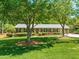 Charming single-story brick home with well-manicured lawn and mature trees at 7 Dubarry Ct, Durham, NC 27705