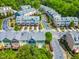 Aerial view of townhome community featuring colorful exteriors, manicured landscaping and winding roads at 705 Samuel Cary Dr, Cary, NC 27511