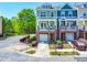 Charming townhome with a brick front, balcony, and attached garage on a cul-de-sac street at 705 Samuel Cary Dr, Cary, NC 27511