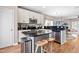 Beautiful kitchen with stainless appliances, an island with seating, and sleek granite countertops at 705 Samuel Cary Dr, Cary, NC 27511