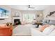 Bright living room featuring a cozy fireplace, hardwood floors, and lots of natural light at 705 Samuel Cary Dr, Cary, NC 27511