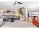 Comfortable living room with an open layout, hardwood floors, and seamless flow to the dining area at 705 Samuel Cary Dr, Cary, NC 27511