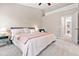 Cozy main bedroom with plush carpet, neutral walls, and a walk-in closet at 705 Samuel Cary Dr, Cary, NC 27511