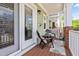 Inviting porch with chairs, a table, and a view of the surrounding neighborhood at 705 Samuel Cary Dr, Cary, NC 27511