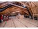 Unfinished attic space featuring exposed beams and wooden flooring at 7101 Gibson Creek Pl, Cary, NC 27519