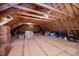 Unfinished attic space featuring exposed beams and wooden flooring at 7101 Gibson Creek Pl, Cary, NC 27519